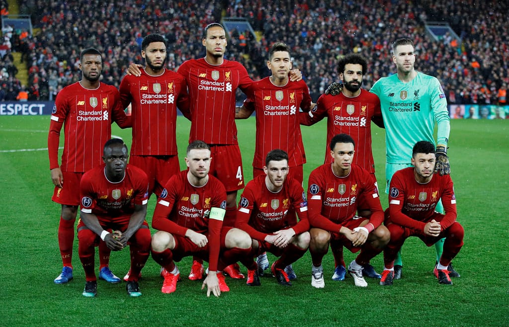 Liverpool players line up for a photo before a match